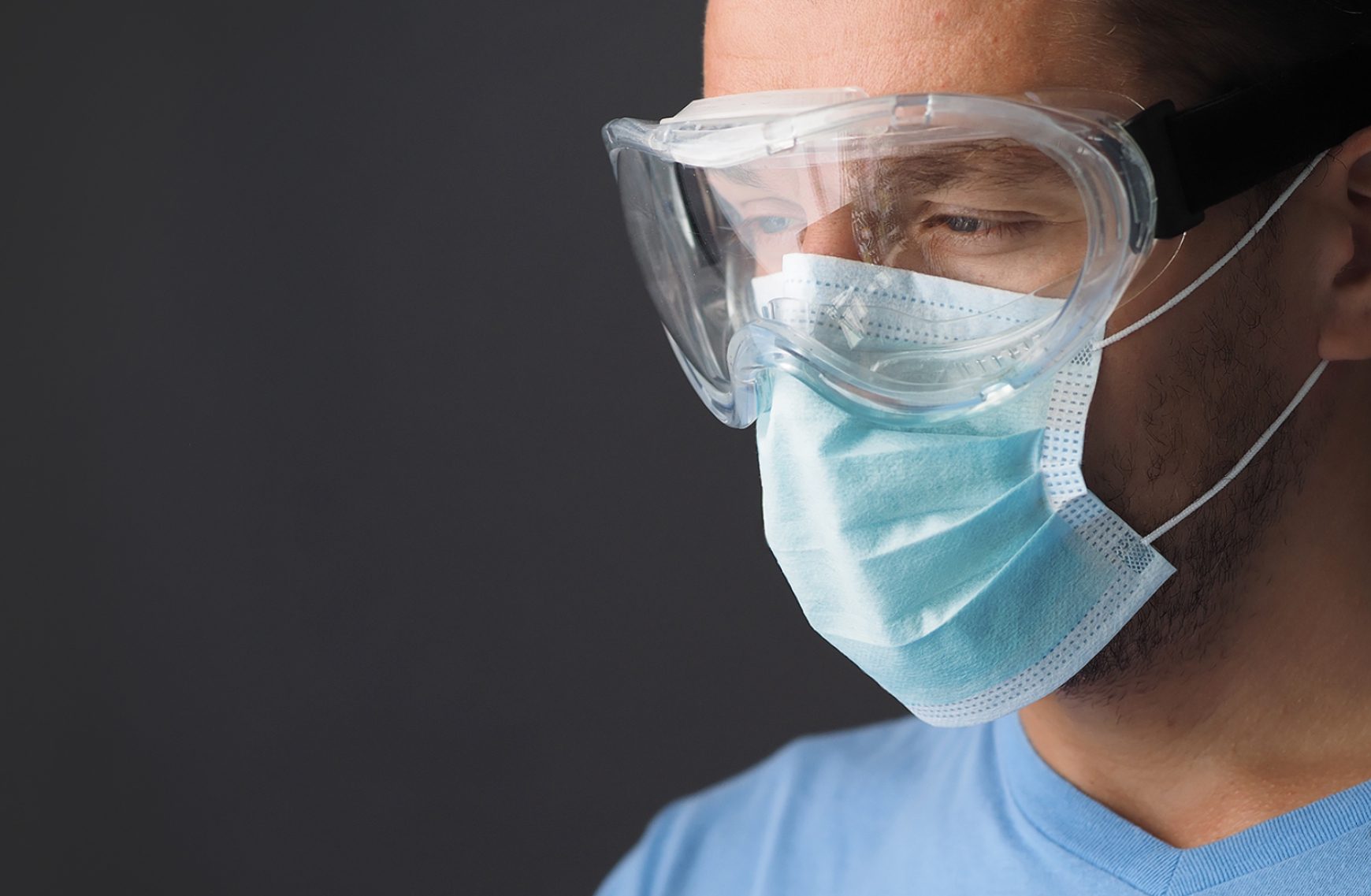 Man wearing ppe goggles and face mask