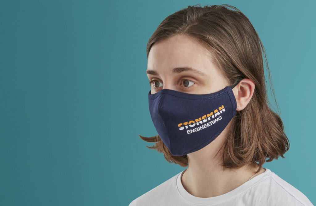 Woman wearing branded ppe mask