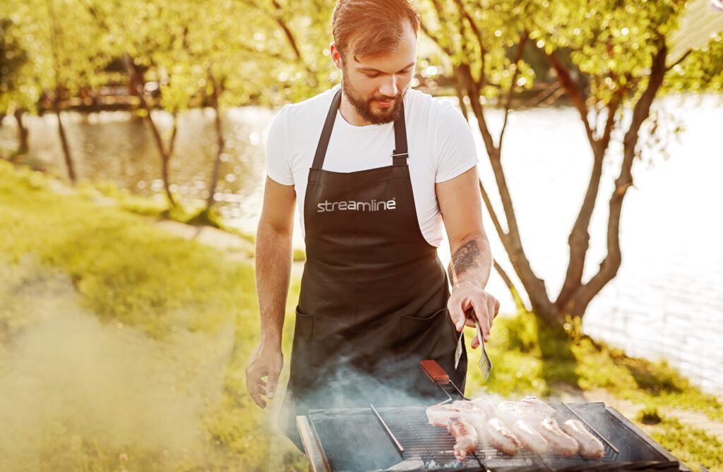 Man wearing summer promotional products at a bbq