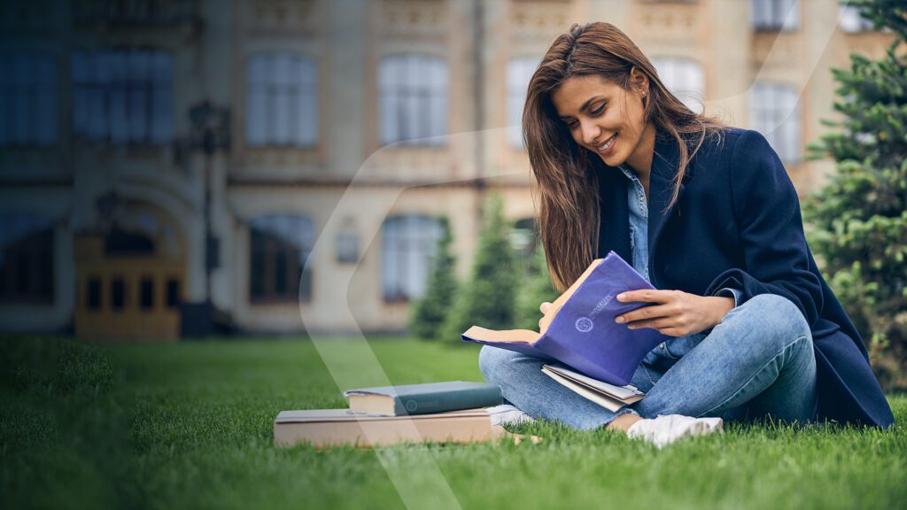 a university student studies outside her campus